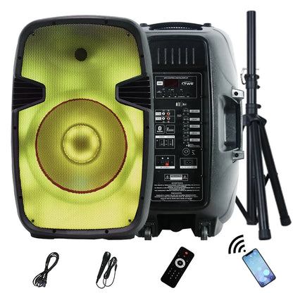 A portable PA speaker system featuring a large circular yellow-lit driver on the front panel, with a comprehensive control interface on the side displaying various input/output ports and a digital display. The setup includes a remote control, a wired microphone, an audio cable, a smartphone indicating Bluetooth connectivity, and a telescopic tripod stand