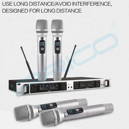 A dual-channel wireless microphone system displayed with two handheld mics placed on top of a black rack-mountable receiver, featuring an overhead text overlay that reads 'USE LONG DISTANCE/AVOID INTERFERENCE, DESIGNED FOR LONG DISTANCE'.