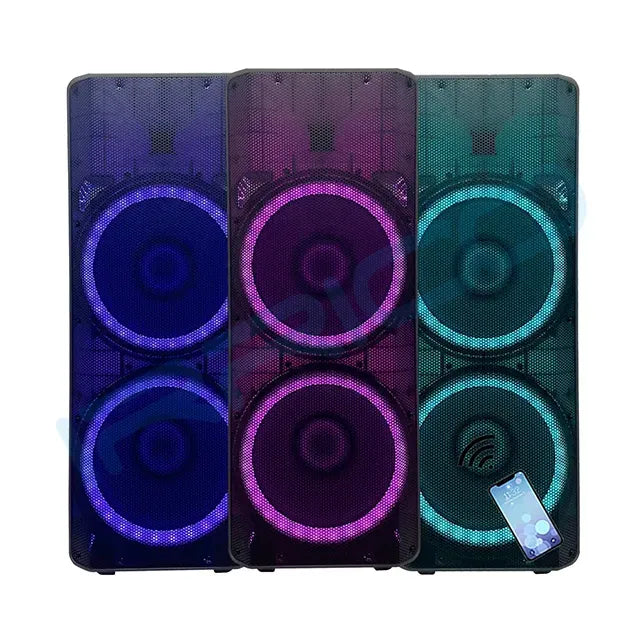 Four tall, rectangular portable speakers standing side-by-side, each enclosed in a black mesh grille with two large circular drivers illuminated by vibrant RGB lighting in pink, blue, yellow, and green from left to right; a smartphone displaying a music player interface hovers near the bottom right speaker, indicating Bluetooth connectivity