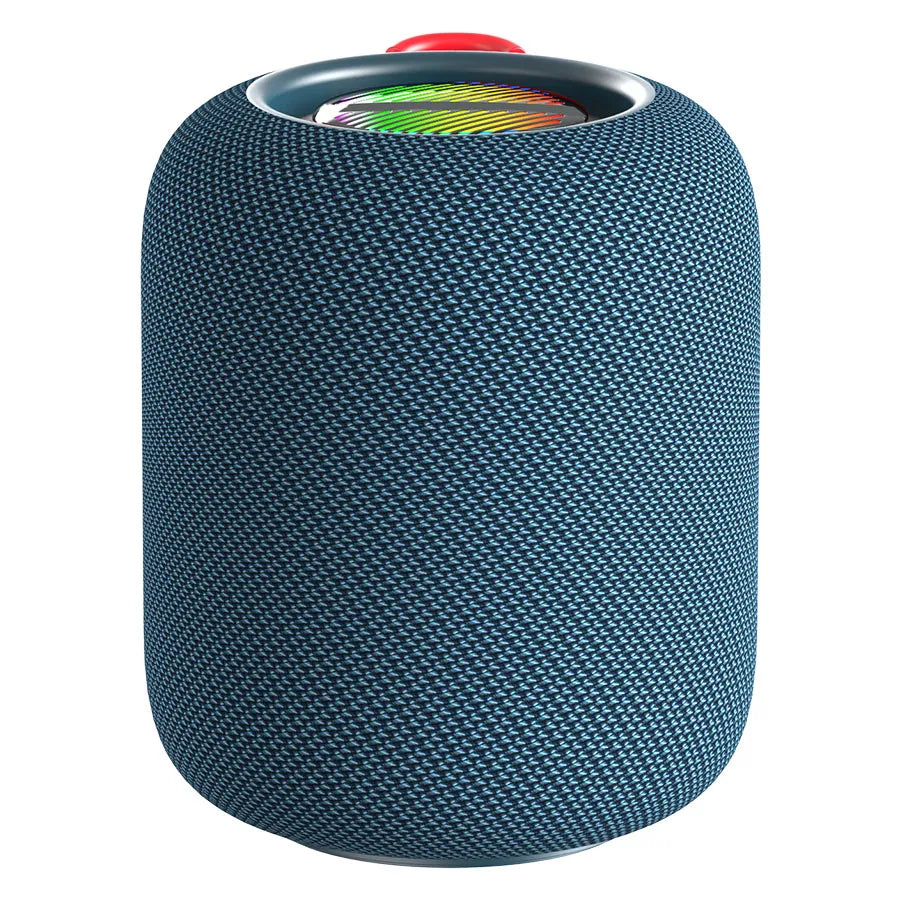 A dark blue cylindrical portable speaker with a textured, woven fabric exterior and a visible colorful RGB light ring at the top, partially obscured by a bright red fabric loop handle.