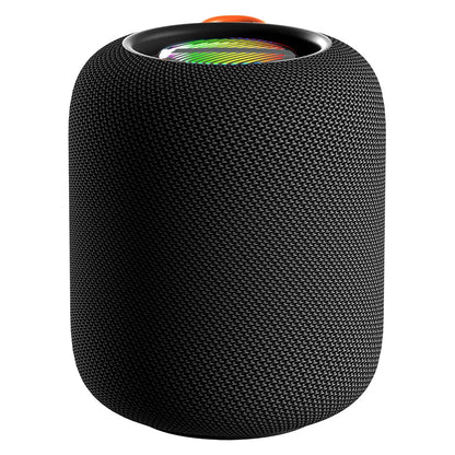 A black cylindrical portable speaker with a textured, woven fabric exterior and a visible colorful RGB light ring at the top, partially obscured by a bright orange fabric loop handle.