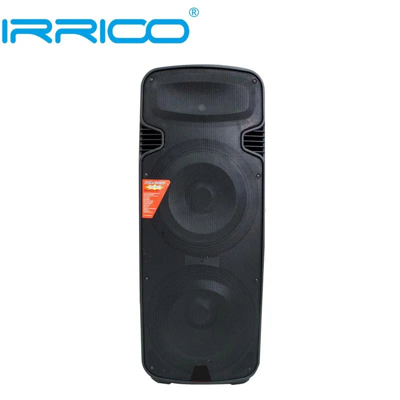 Front view of a tall, black portable speaker with a dual woofer design, featuring a mesh grille that covers the drivers and a prominent orange triangular brand sticker on the left side.