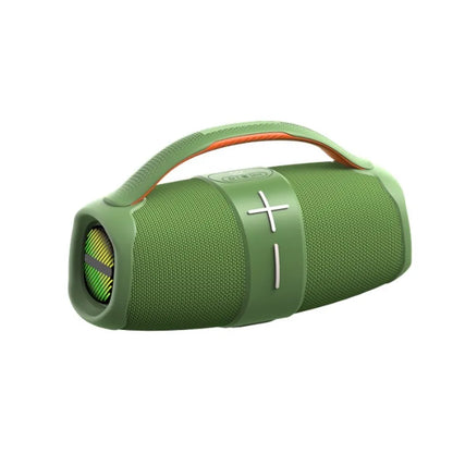 A portable green fabric-covered Bluetooth speaker with a cylindrical design, featuring a built-in handle with an orange interior, volume control buttons, and a visible speaker grill on the end.