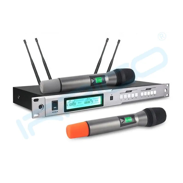 A professional UHF wireless microphone system featuring a rack-mountable receiver with a blue LCD screen and four antennas, accompanied by two handheld microphones with digital displays, one resting on the receiver and the other placed in front with an orange base.