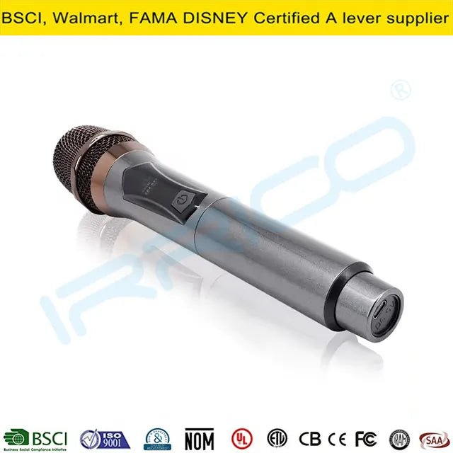 A single handheld wireless microphone with a metallic silver body and black accents, featuring a mesh grille and a small digital display, placed on a white reflective surface.